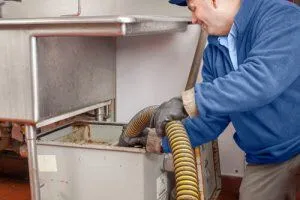 a serviceman cleaning grease trap1771072384 prnja5uk8ib8tus73brg4t2z5dpoya4tklrhr4uymo 1